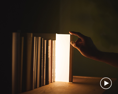 night book emits warm, soft light when pulled from bookcase