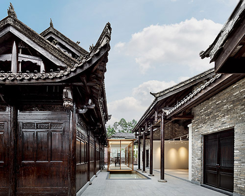 pleasanthouse inserts two glass volumes into nanxianglou art hotel in shenzhen