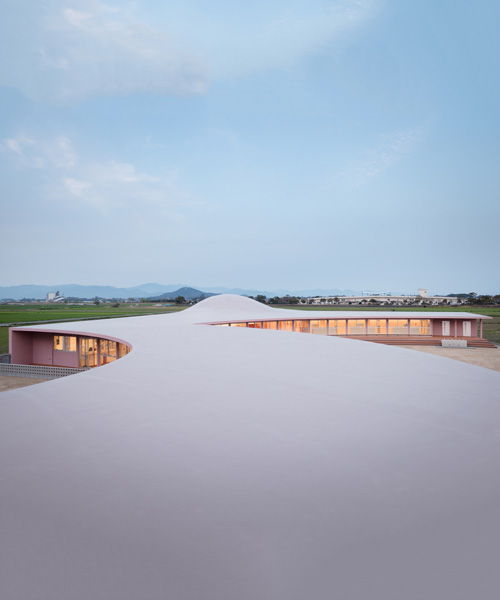 ryuji fujimura tops subaru nursery school in japan with curved concrete roof