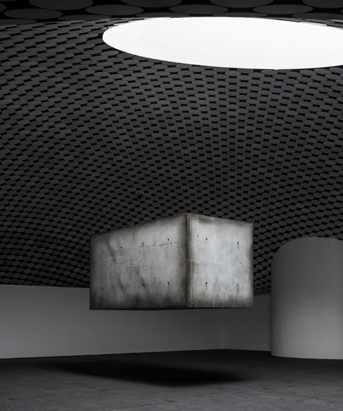 studio drift's floating monolith returns as centerpiece to latest exhibition 'elemental'
