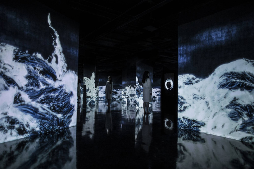 teamlab fills former oil tanks with 'digital universe of water particles' in shanghai