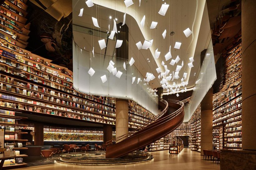 tomoko ikegai / ikg inc lights chinese bookstore with fluttering sheets of paper