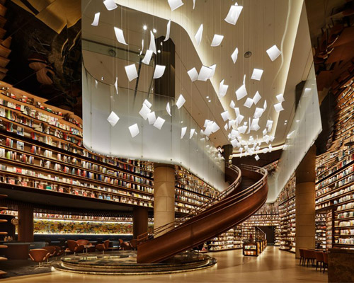 tomoko ikegai / ikg inc illuminates chinese bookstore with fluttering sheets of paper