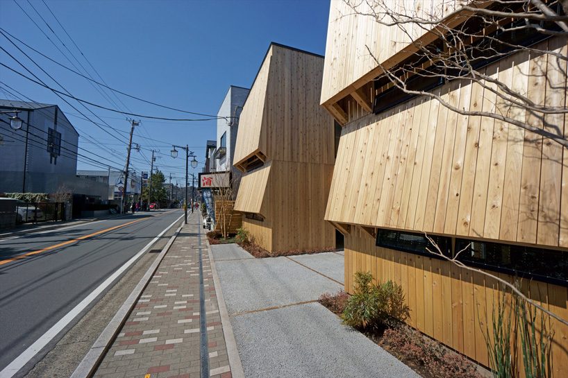 yuji tanabe builds commercial block of twin wooden buildings in japan