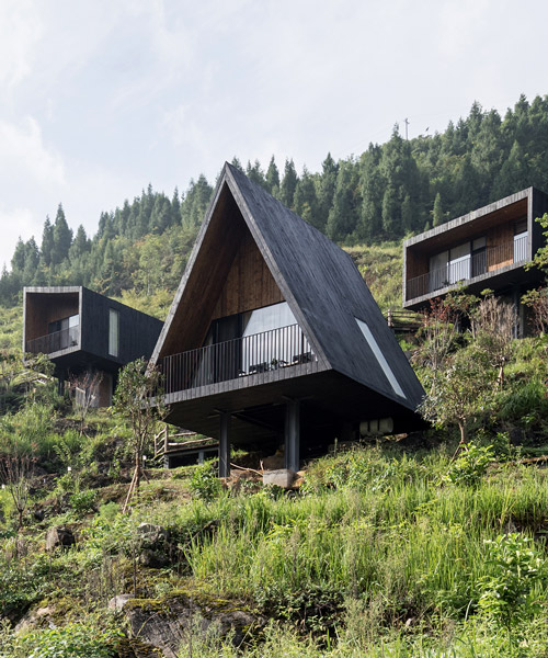 ZJJZ builds charred timber volumes on a hillside in rural china for 'woodhouse hotel'