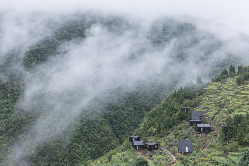 ZJJZ builds charred timber volumes on a hillside in rural china for 'woodhouse hotel' designboom