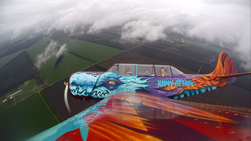 graffiti airplane dragon takes to the skies (a spray painted yak 52)