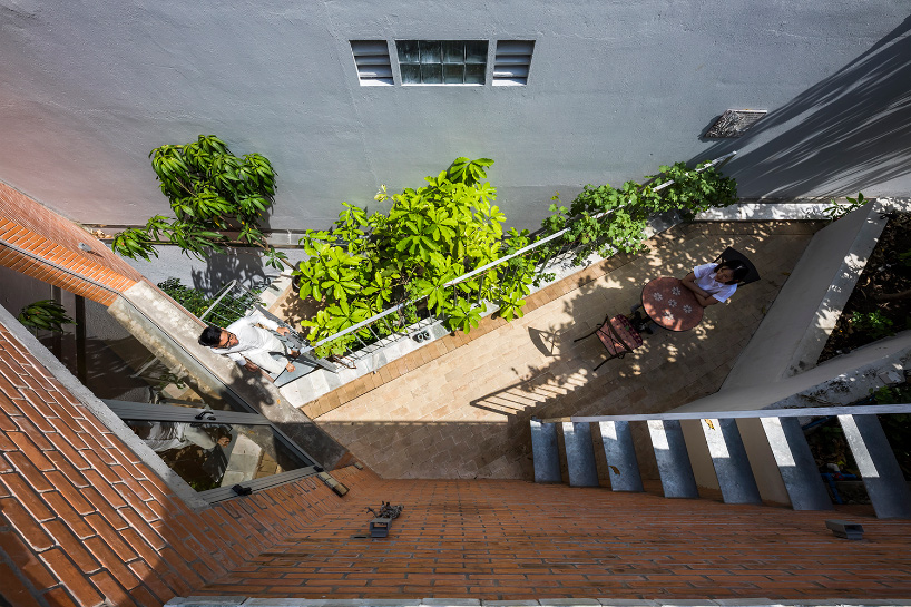 VTN architects tops 'ha house' in vietnam with one continuous garden