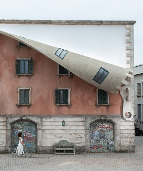 alex chinneck 'unzips' a building's traditional façade for milan design week