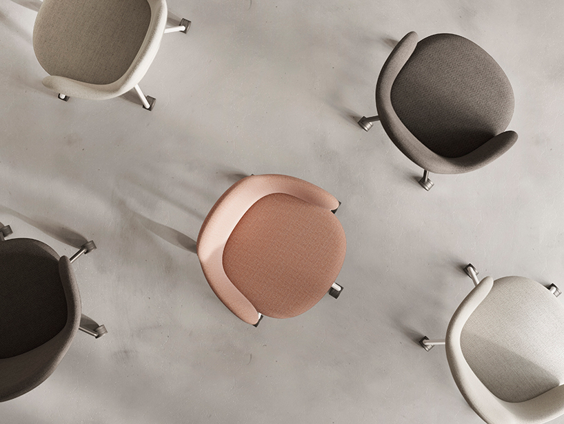 alki lan chair holds self-adjusting mechanisms within clean curving form