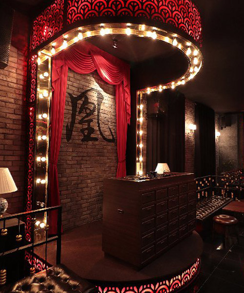 another tales applies red brick and metal finishes to the madam wong bar in malaysia