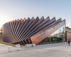 bjarke ingels group designs domino-like copper façade for business school in massachusetts
