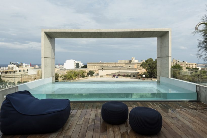architrend tops house B in malta with see-through swimming pool