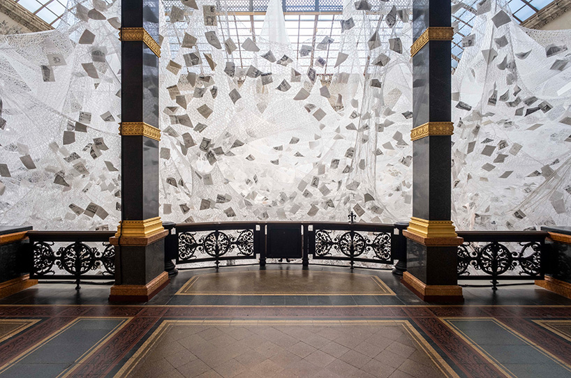 chiharu shiota weaves 'cloud of thoughts' within the atrium at gropius bau
