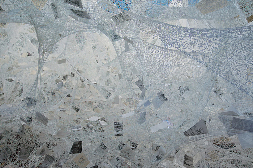 chiharu shiota weaves 'cloud of thoughts' within the atrium at gropius bau