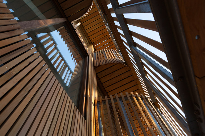 GG-loop clads maritime-inspired apartment complex in waves of wooden slats designboom freebooter