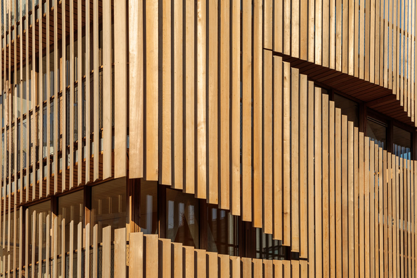 GG-loop clads maritime-inspired apartment complex in waves of wooden slats designboom freebooter