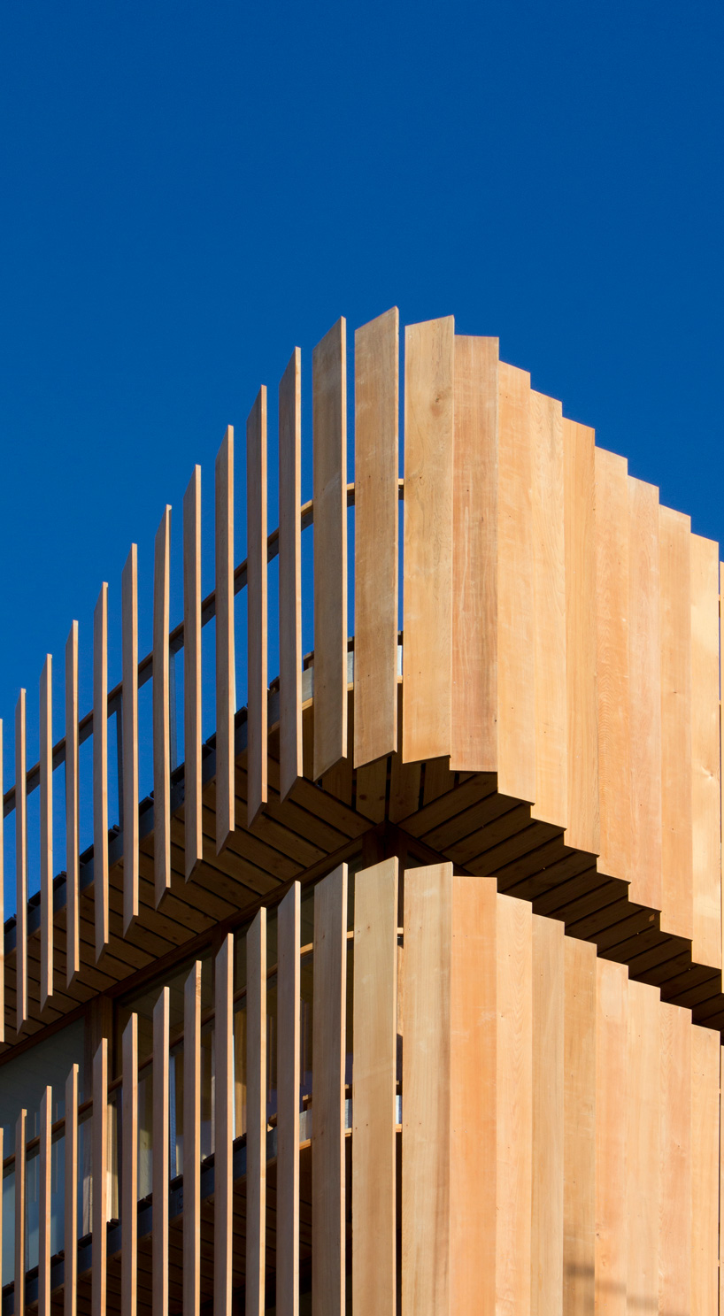 GG-loop clads maritime-inspired apartment complex in waves of wooden slats designboom freebooter