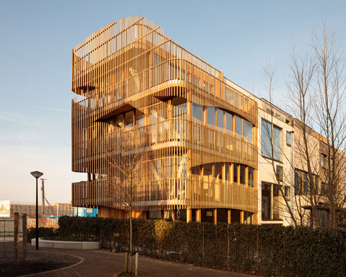 GG-loop clads maritime-inspired apartments in waves of wooden slats