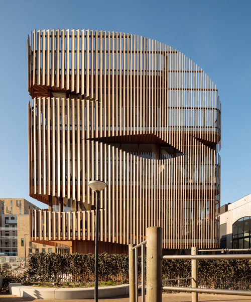 GG-loop clads maritime-inspired apartments in waves of wooden slats
