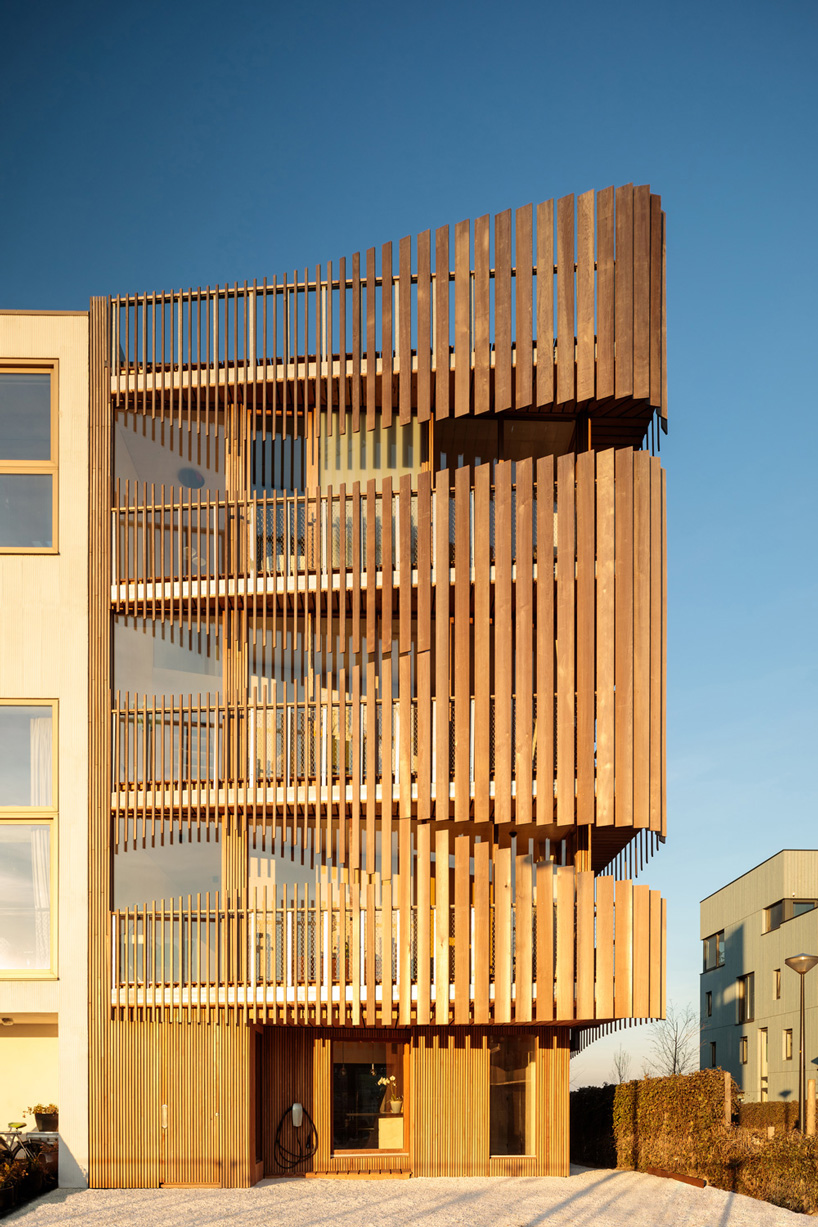 GG-loop clads maritime-inspired apartments in waves of wooden slats