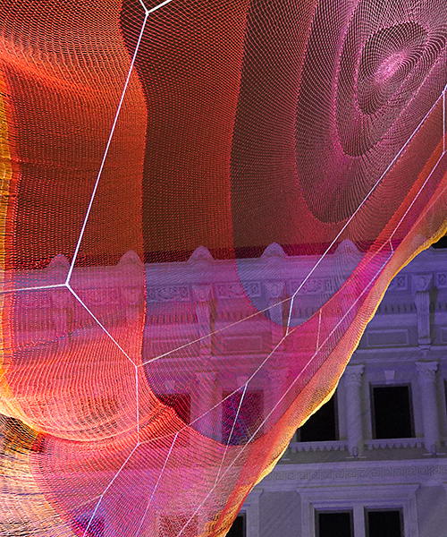 janet echelman's ethereal net sculpture floats above the streets of hong kong