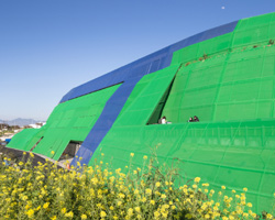 jean nouvel's university building in cyprus is an 'earthwork' clad with colored fabric