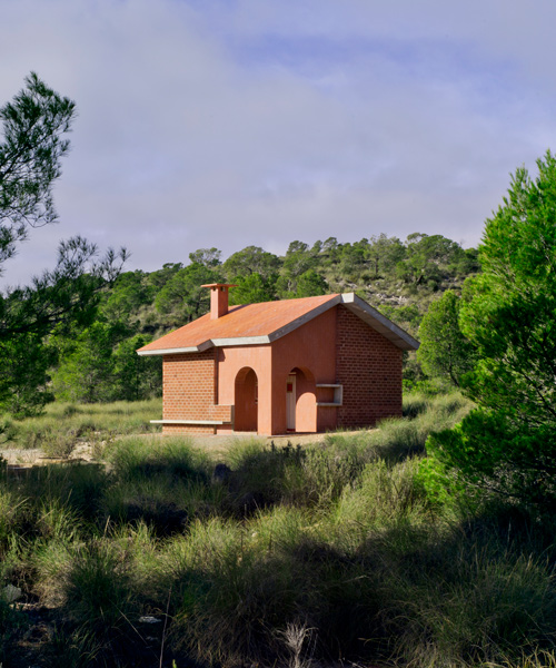 martin lejarraga restores remote shelter with red bricks that contrast spain's green landscape