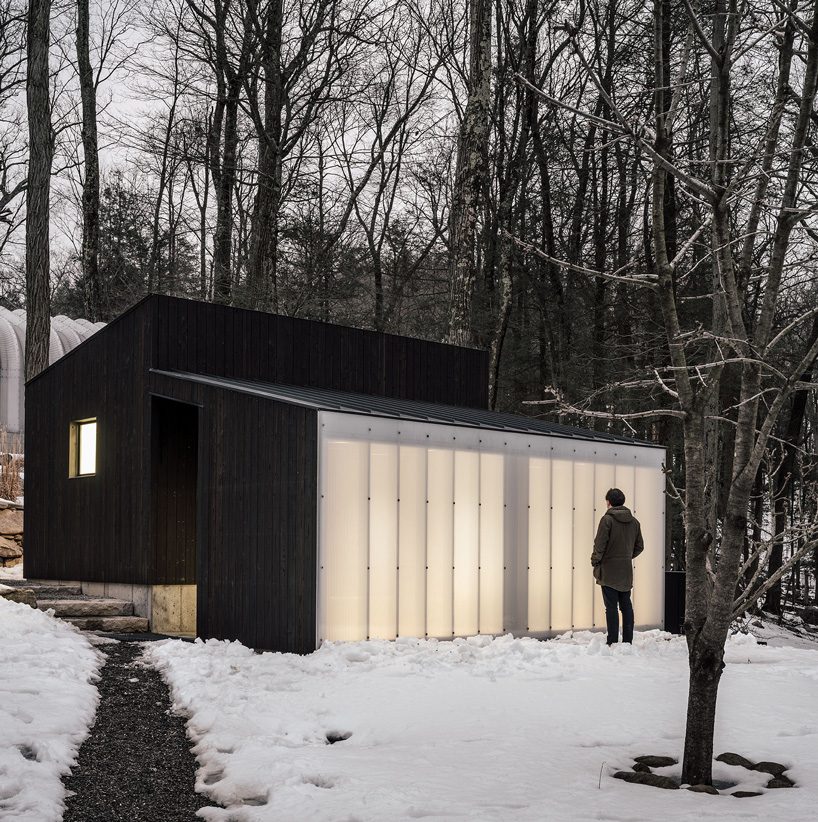 miguel quismondo builds small pavilion with charred wood and a polycarbonate façade