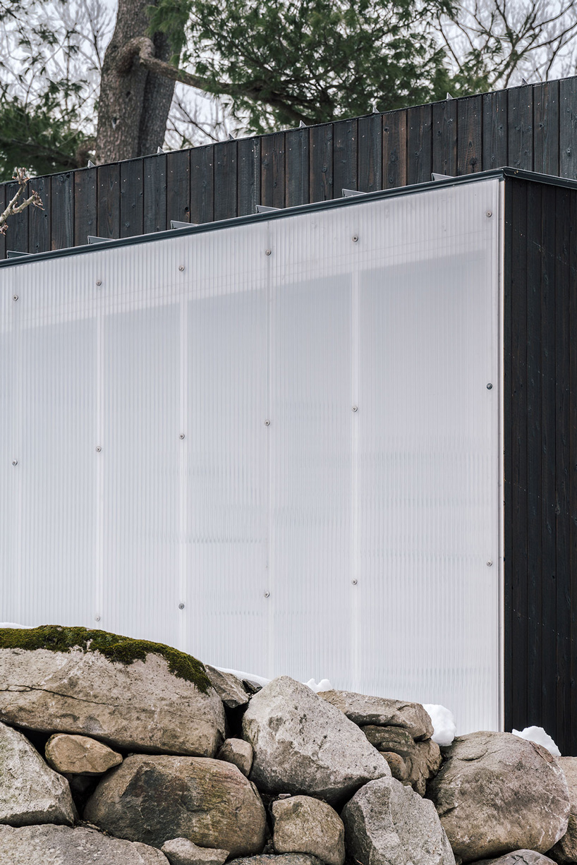 miguel quismondo builds small pavilion with charred wood and a polycarbonate façade