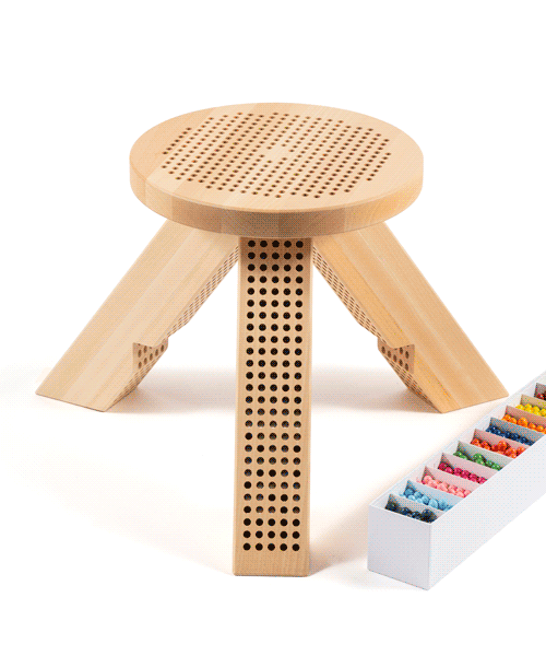 miu miu unveils perforated stool inviting users to change its color like a board game