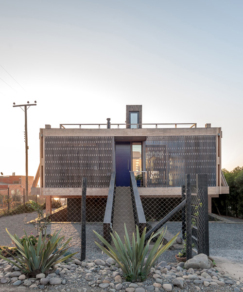 a detached latticed structure wraps around tacna house by par arquitectos