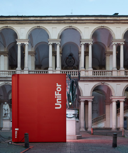ron gilad exhibits a giant red book to celebrate 50 years of unifor during milan design week