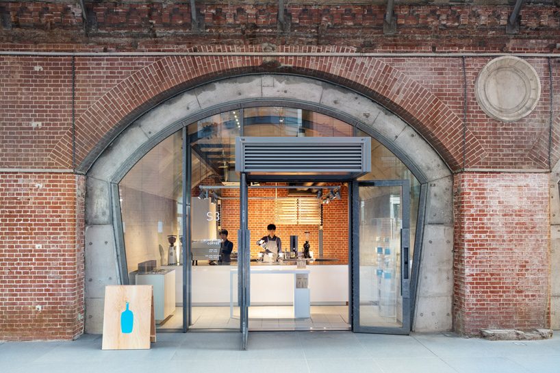 schemata architects tucks eleventh blue bottle cafe under 100-year-old bridge in tokyo