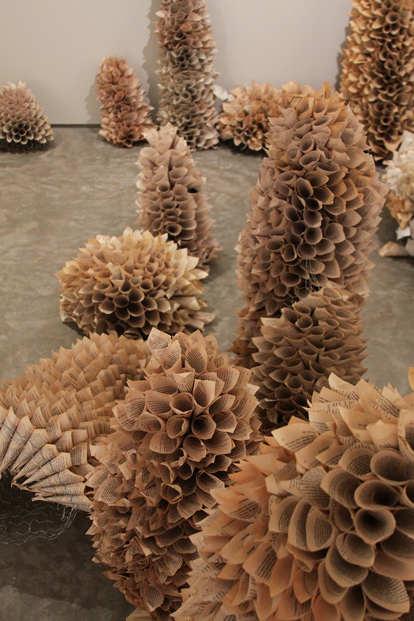 samuelle green uses paper and chicken wire to intricately weave an otherworldly cove