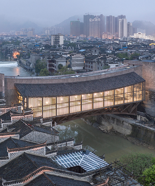 spanning china's picturesque wanrong river, the jishou art museum is open to the public