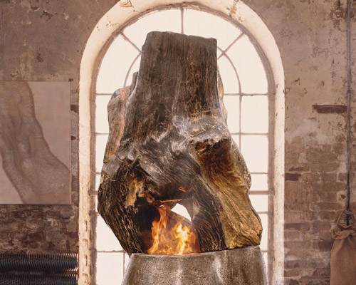 'ascendance' is a petrified wood fireplace designed by metaplace industries