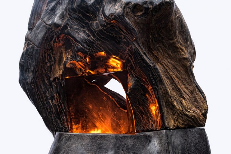 'ascendance' is a petrified wood fireplace designed by metaplace industries
