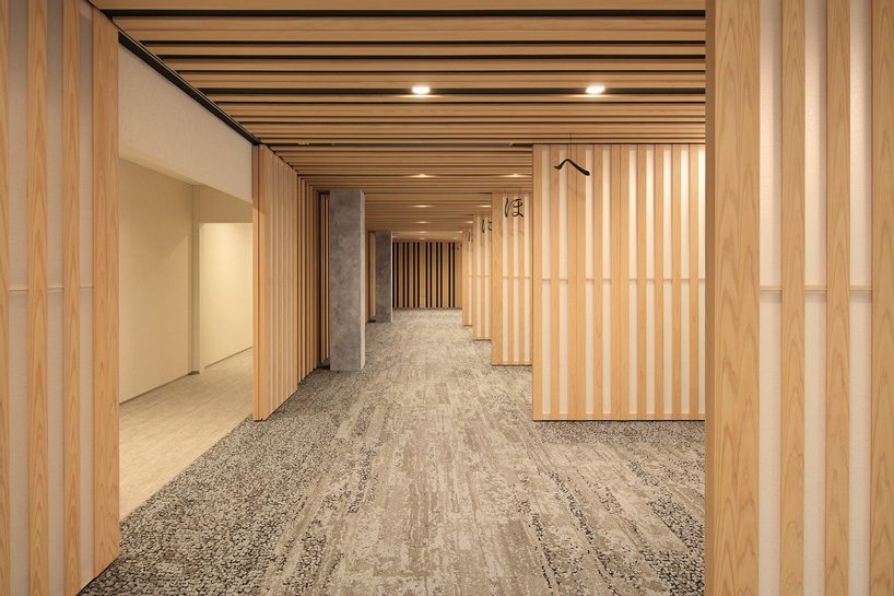 kengo kuma tops buddhist temple in tokyo with half-cylinder aluminum tiles