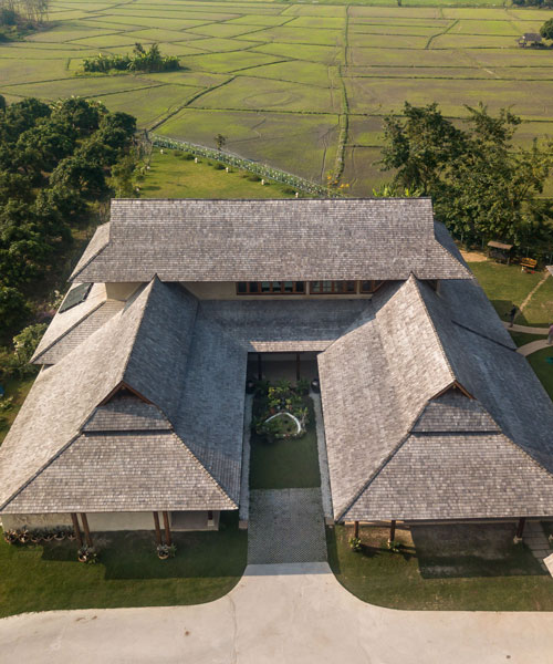 adobe brick and timber create a contemporary 'tale of earth and wood' in thailand