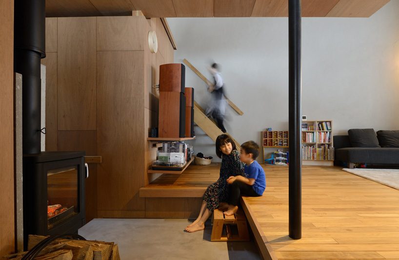 hiroshi horio architects stacks two wooden boxes for family house in japan