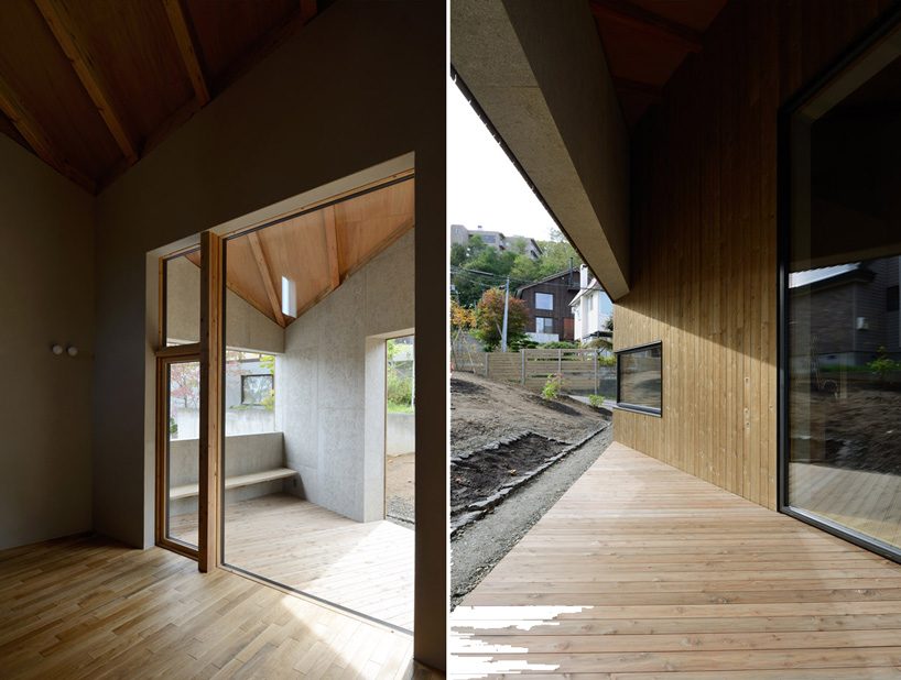 hiroshi horio architects stacks two wooden boxes for family house in japan