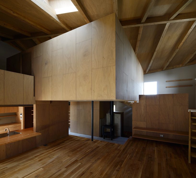 hiroshi horio architects stacks two wooden boxes for family house in japan