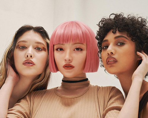 one of the three models featured in this magazine spread is a virtual girl