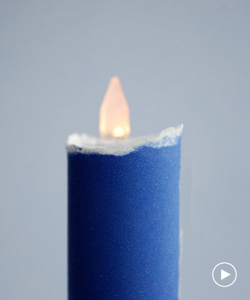 kazuhiro yamanaka rolls A4 paper to create a flickering LED candle