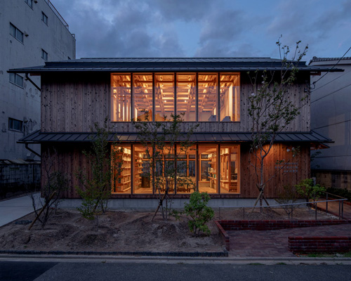 kazuya morita builds wooden lattice frame structure for archive library in kyoto