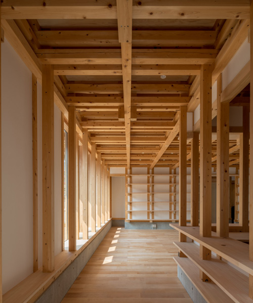 kazuya morita builds wooden lattice frame structure for archive library in kyoto