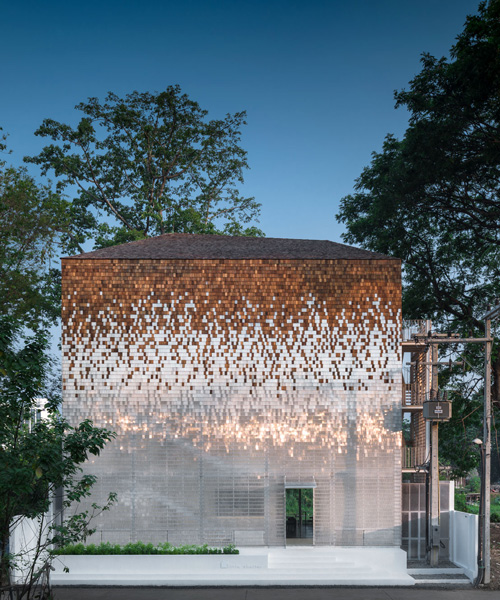 department of architecture adds shimmering façade to little shelter hotel in thailand