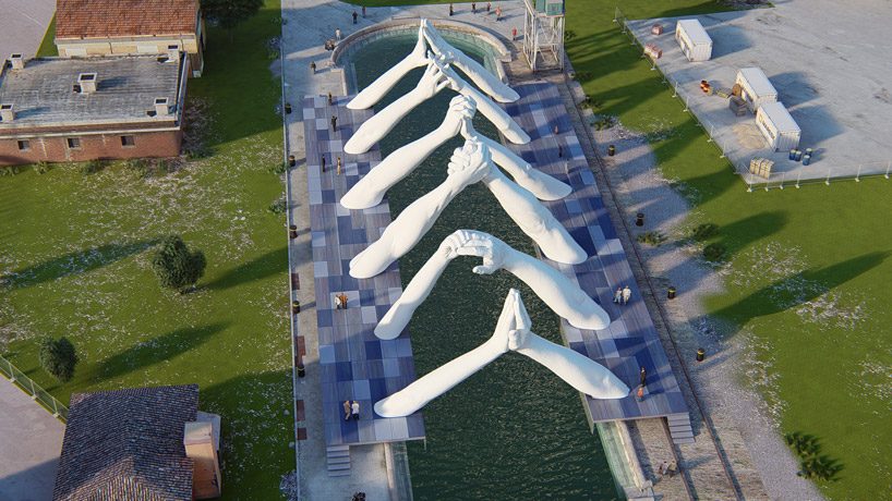 lorenzo quinn joins giant hands to 'build bridges' during venice art biennale 2019 designboom