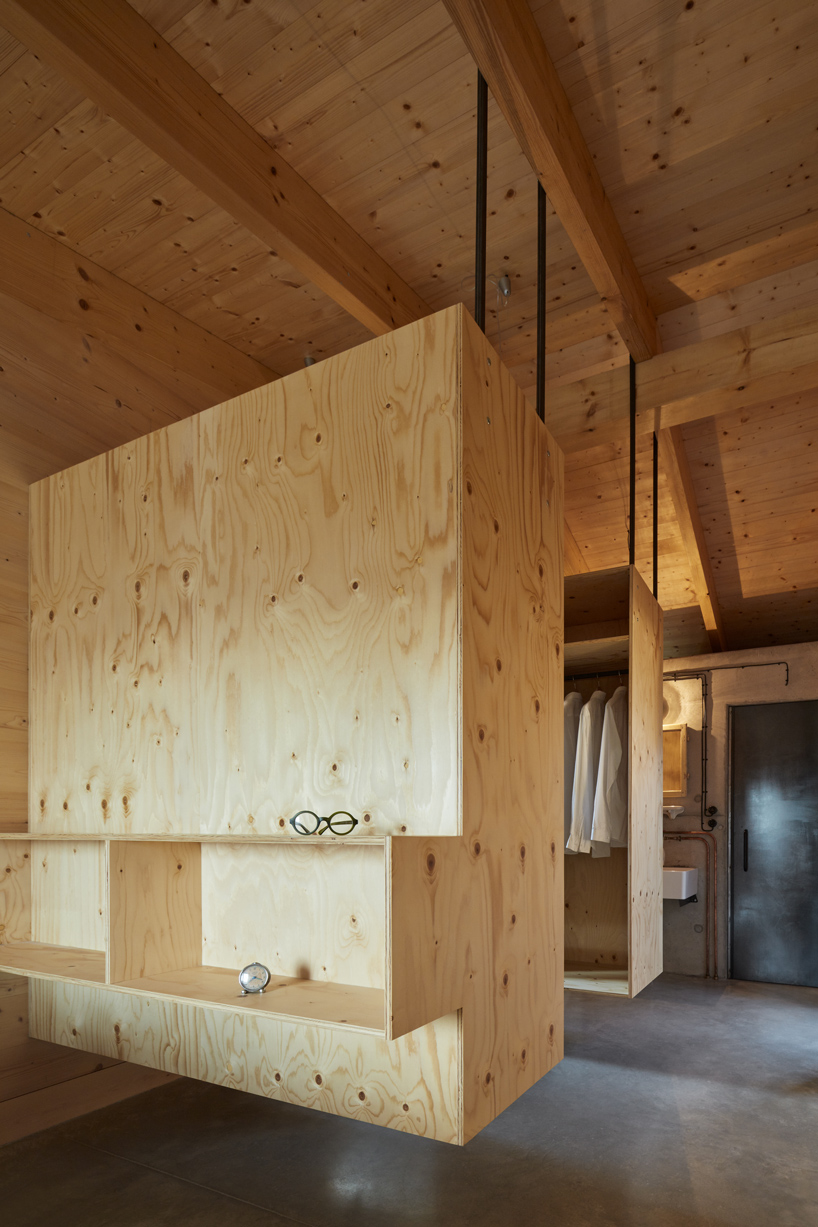 mjolk house behind wall